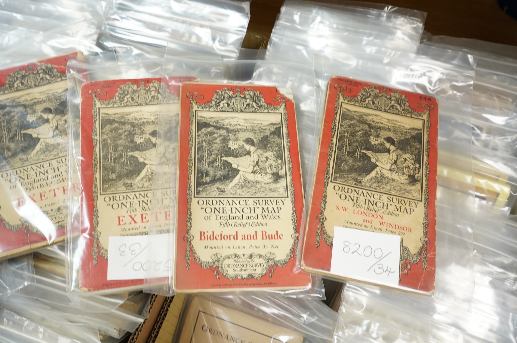 A collection of Ordnance Survey maps including Explorer series 1:25,000, Seventh Series One Inch, together with miscellaneous touring and historic editions (3 boxes)